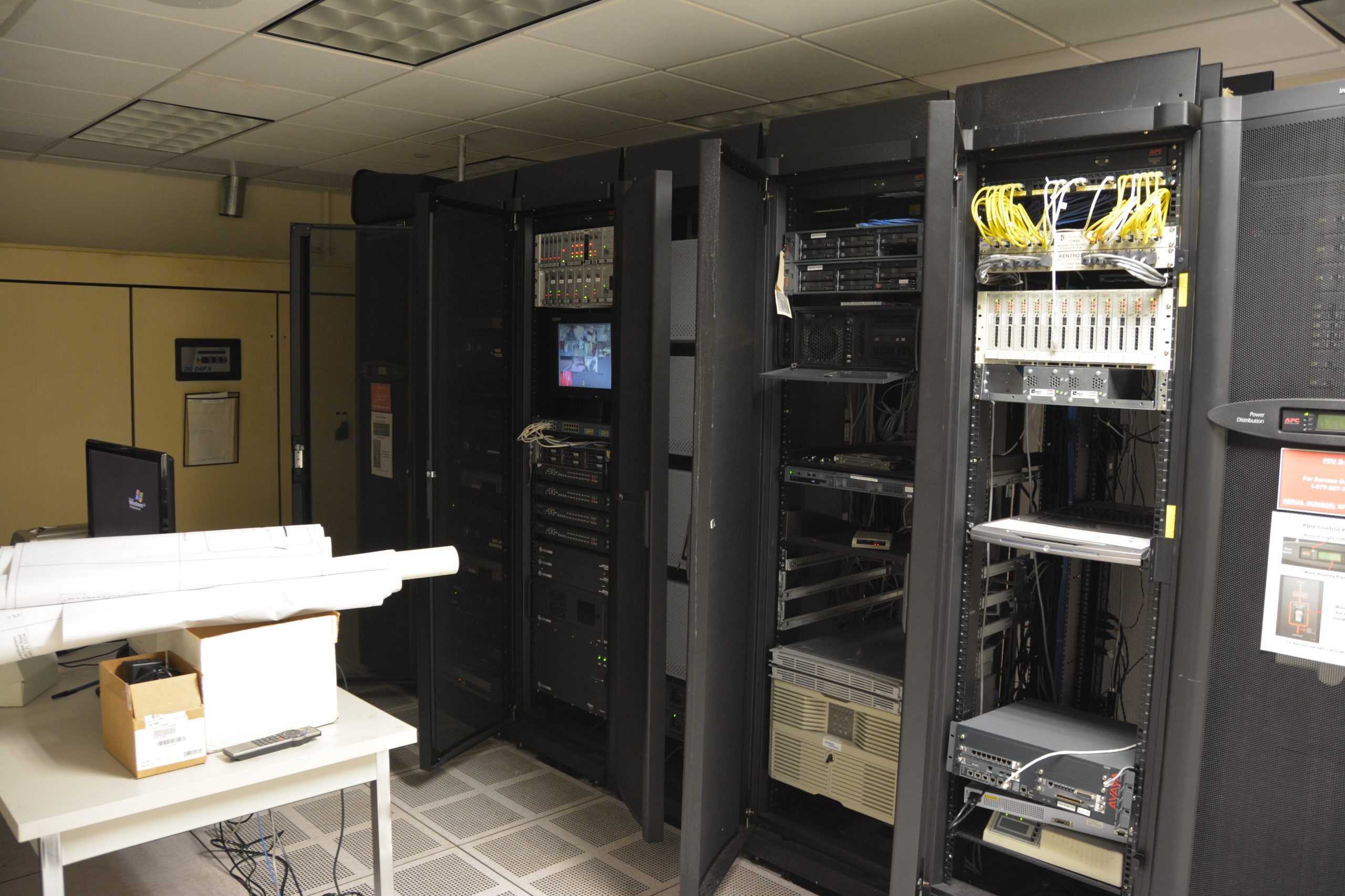 Server racks and network cabling in a server room, 2015.